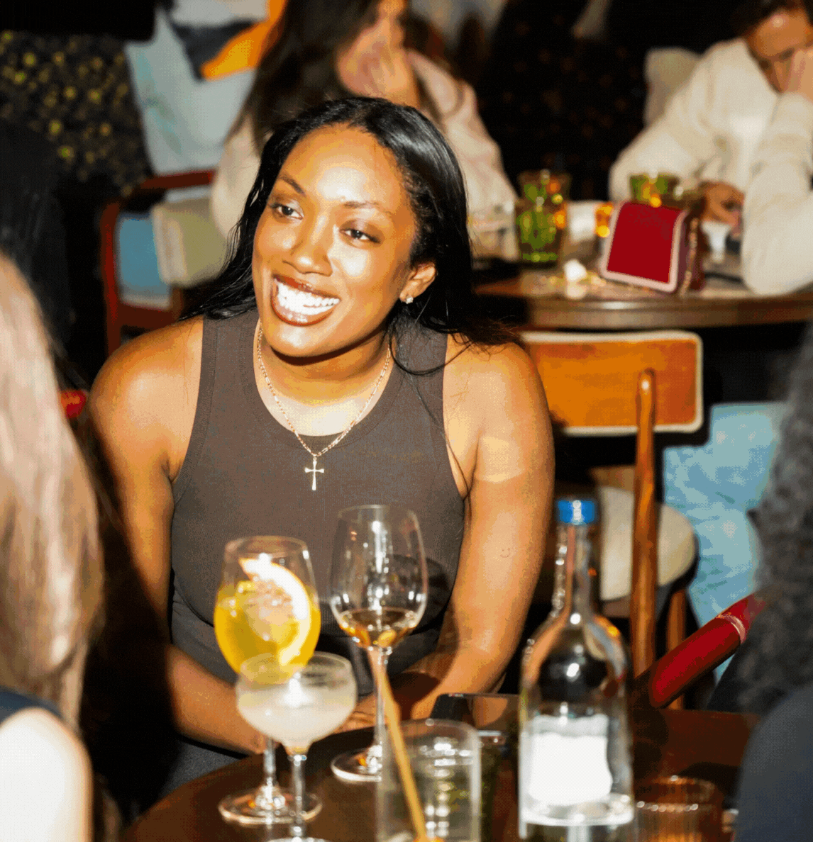 Animated gif of a woman laughing warmly at Nessa restaurant in Soho, capturing the creative and social spirit inspired by the Bloomsbury Group