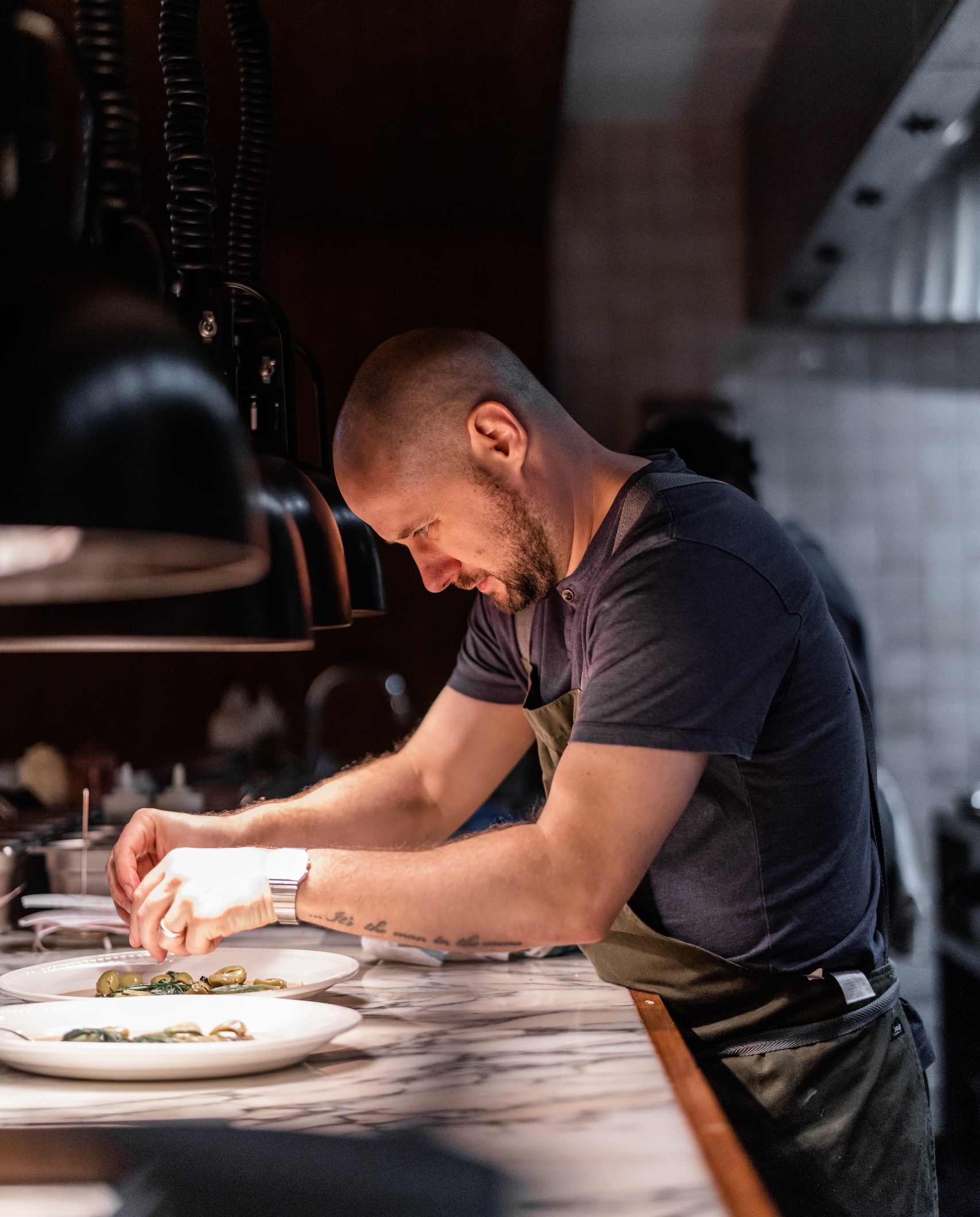 EXECUTIVE CHEF TOM CENCI IN THE KITCHEN AT NESSA.