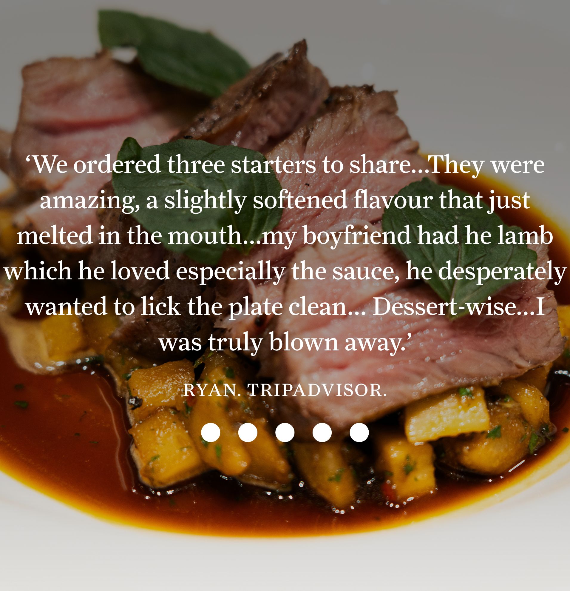 Succulent lamb served over sauce with vegetables, featured in a five-star TripAdvisor review praising its melt-in-the-mouth flavor.