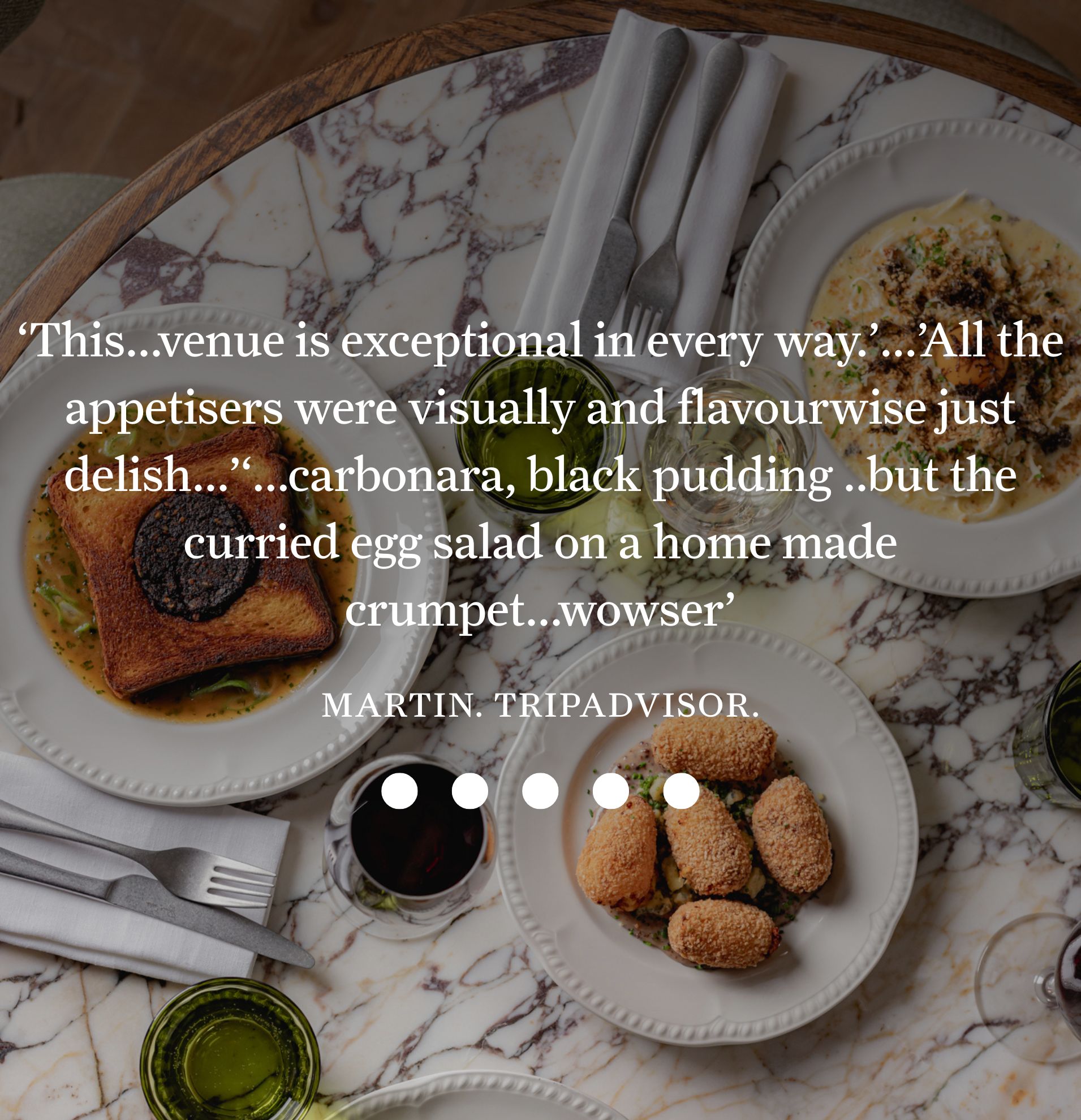 Elegant table set with black pudding toast, curried egg salad, croquettes, and pasta, highlighted in a TripAdvisor review praising visual and flavor excellence.